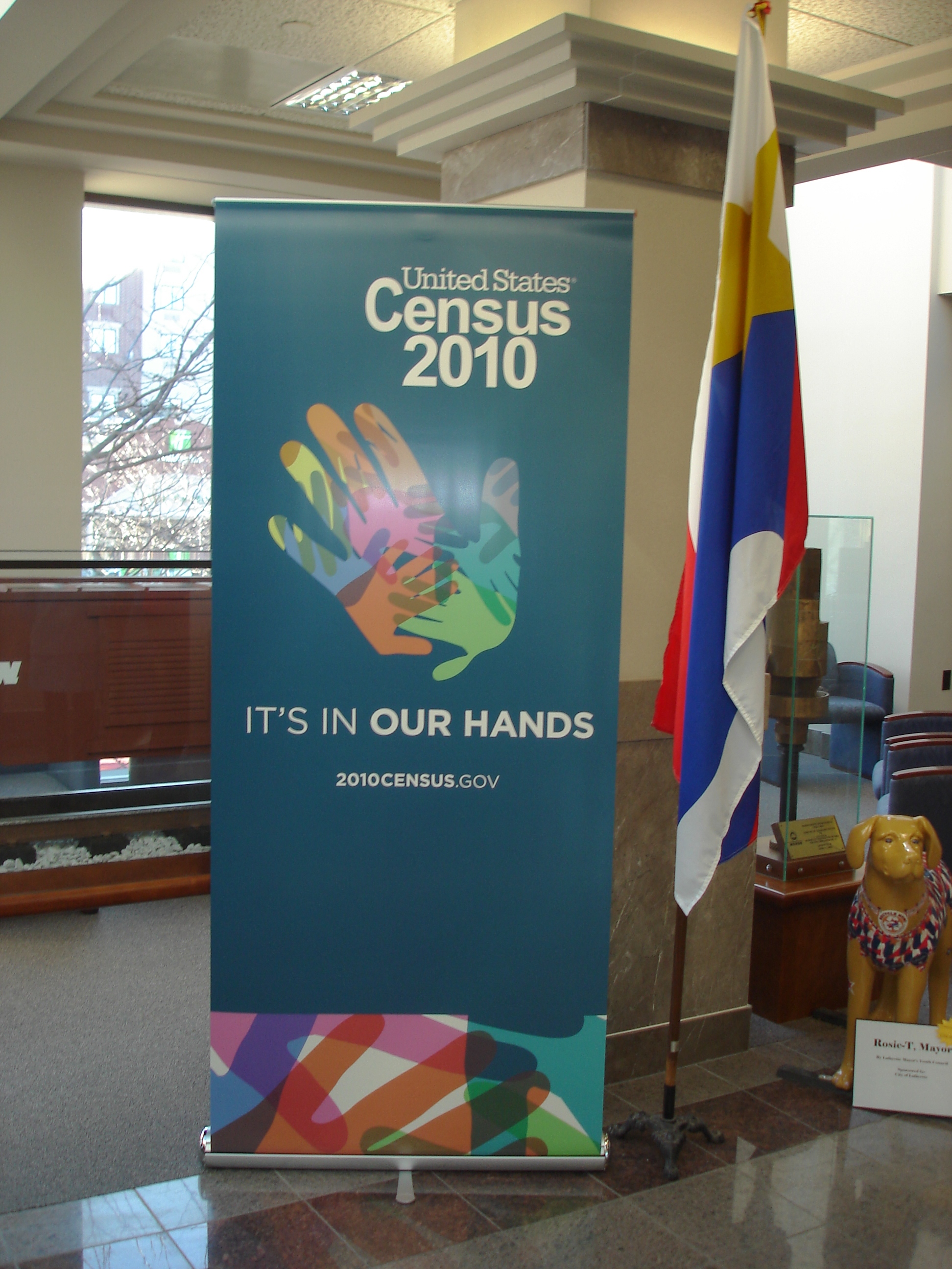 A banner for the 2010 Census next to the state flag